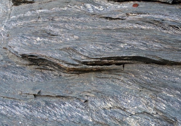 Figure 5: Example of NW-dipping shear bands in the basal thrust of S Norway (Haukeli area), which together with the small-scale folding tell us that the kinematics on this thrust (top-to-SE) was reversed during extensional backsliding of the orogenic wedge (eduction of the underlying Baltican crust). These structures were largely neglected by generations of Caledonian geologists. Hard to believe once you have your eyes set on the asymmetry that the structures define. 