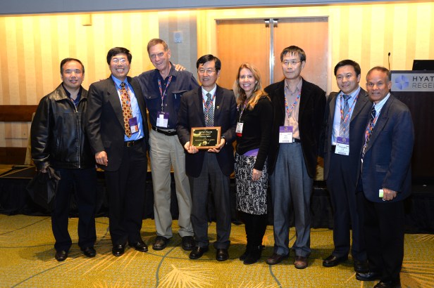 Khandaker (far right) with Dr. Shuwen Dong (3rd from the left) receiving Honorary Fellow 