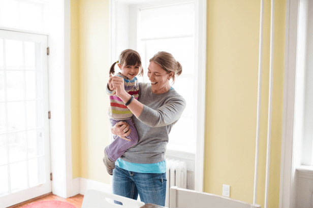 Author dancing with her young daughter