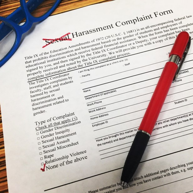 Harassment complaint form marked 'none of the above'